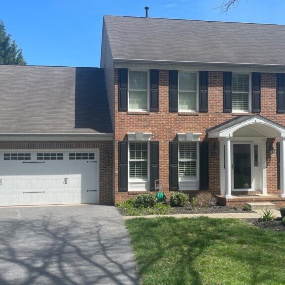1-Apr 16 2024 01_31pm-sieY Large brick house with a side garage,